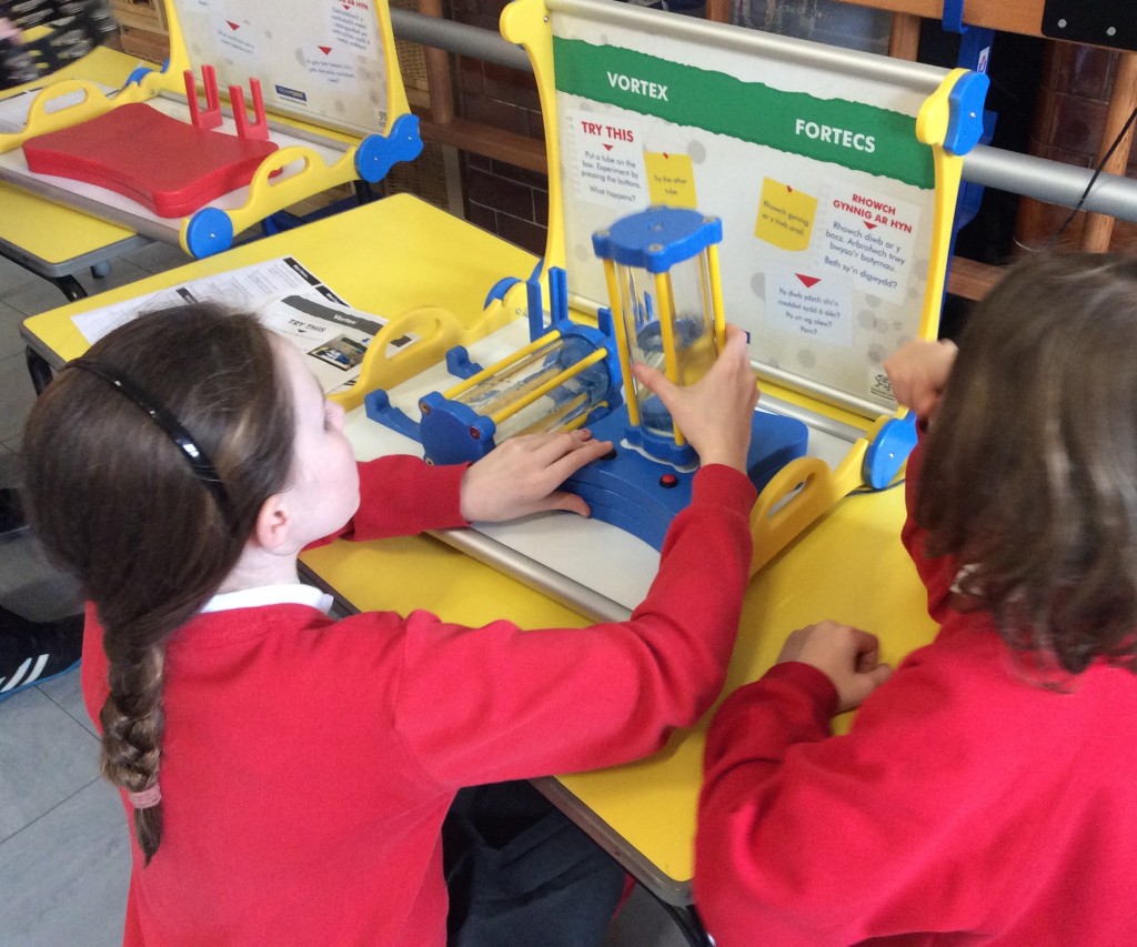 school children doing science experiment