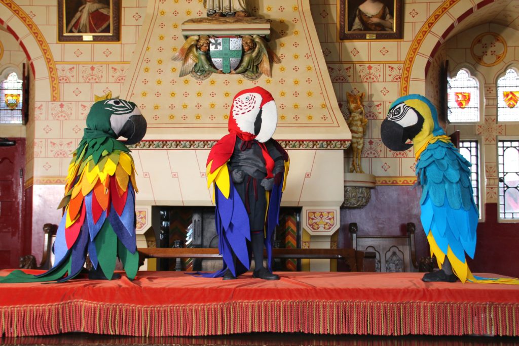 Parrot sculptures on a table