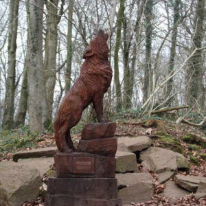 Wooden sculpture of a howling wolf