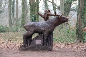 Wooden sculpture of a red deer