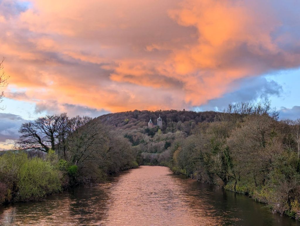 Dramatic orange clouds over Castell Coch and the River Taff